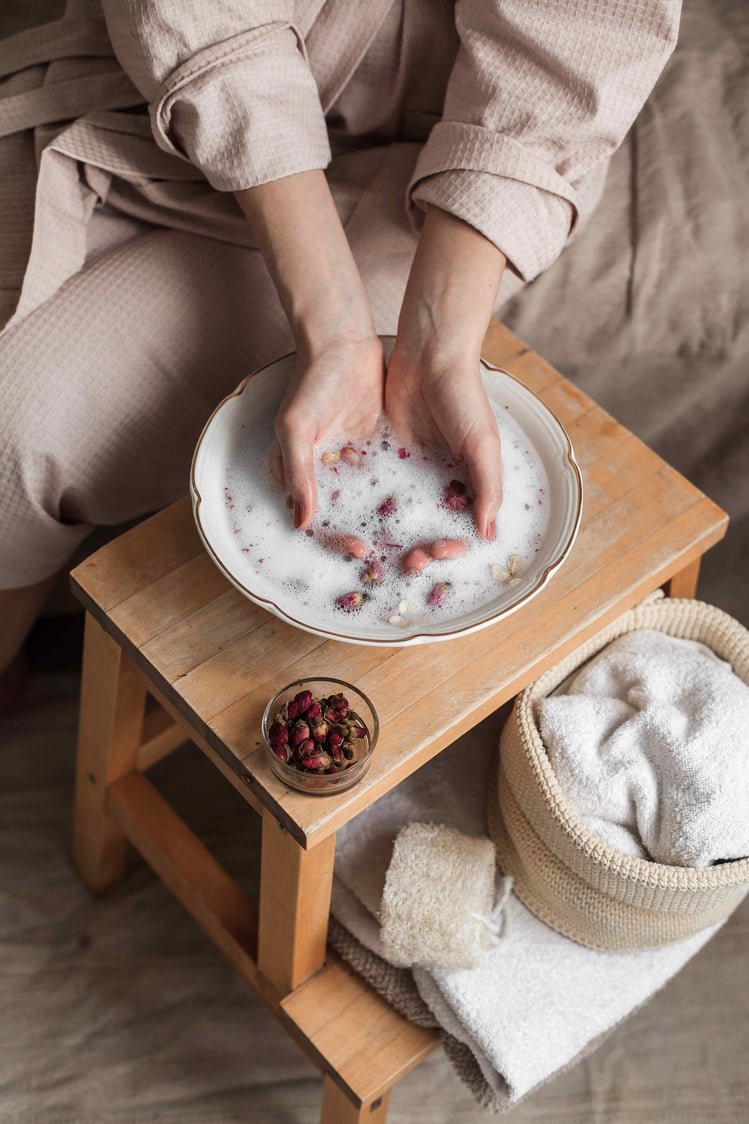 Woman Making a DIY Hand Soak at Home